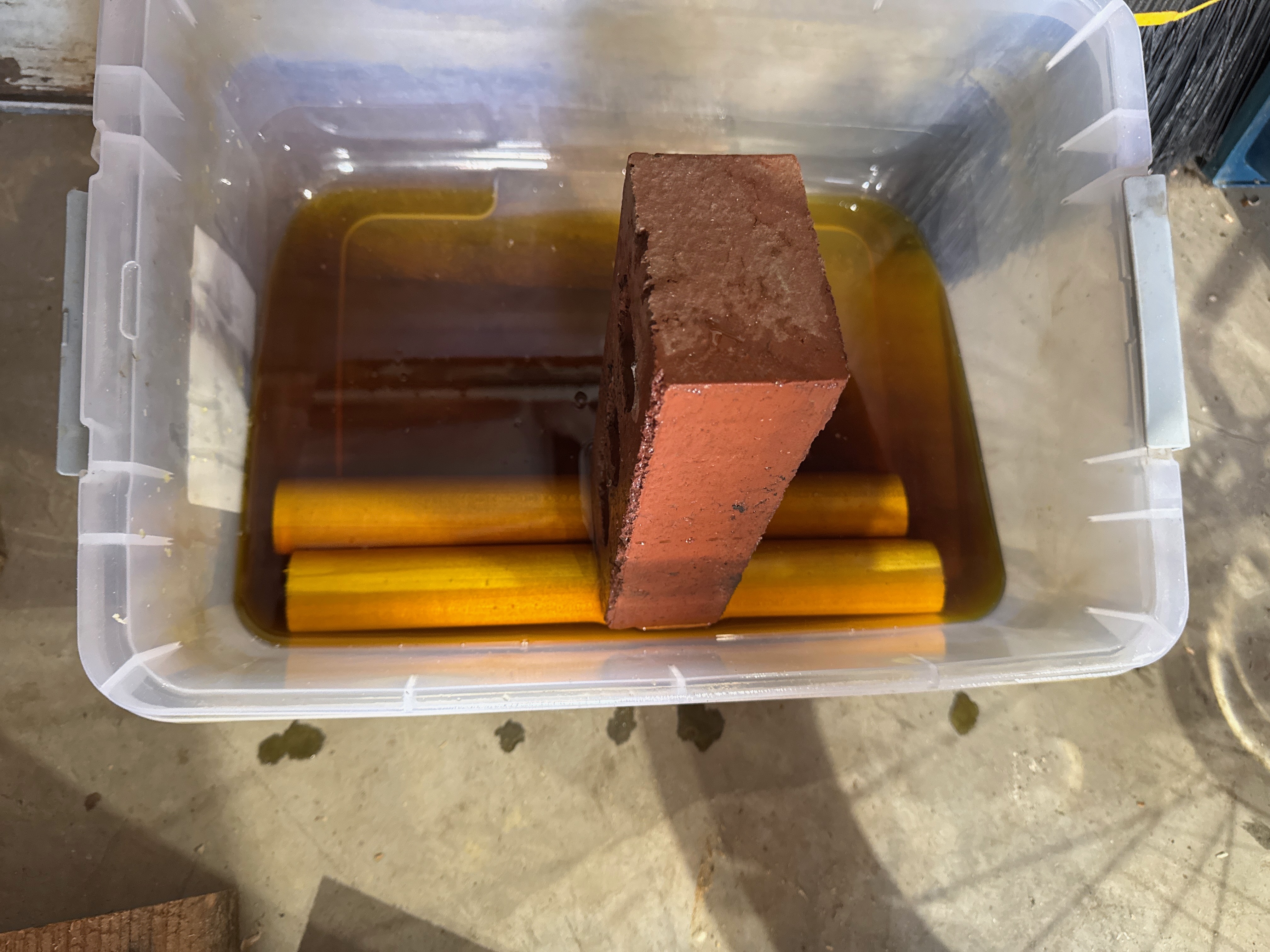 Poplar dowels soaking in boiled linseed oil