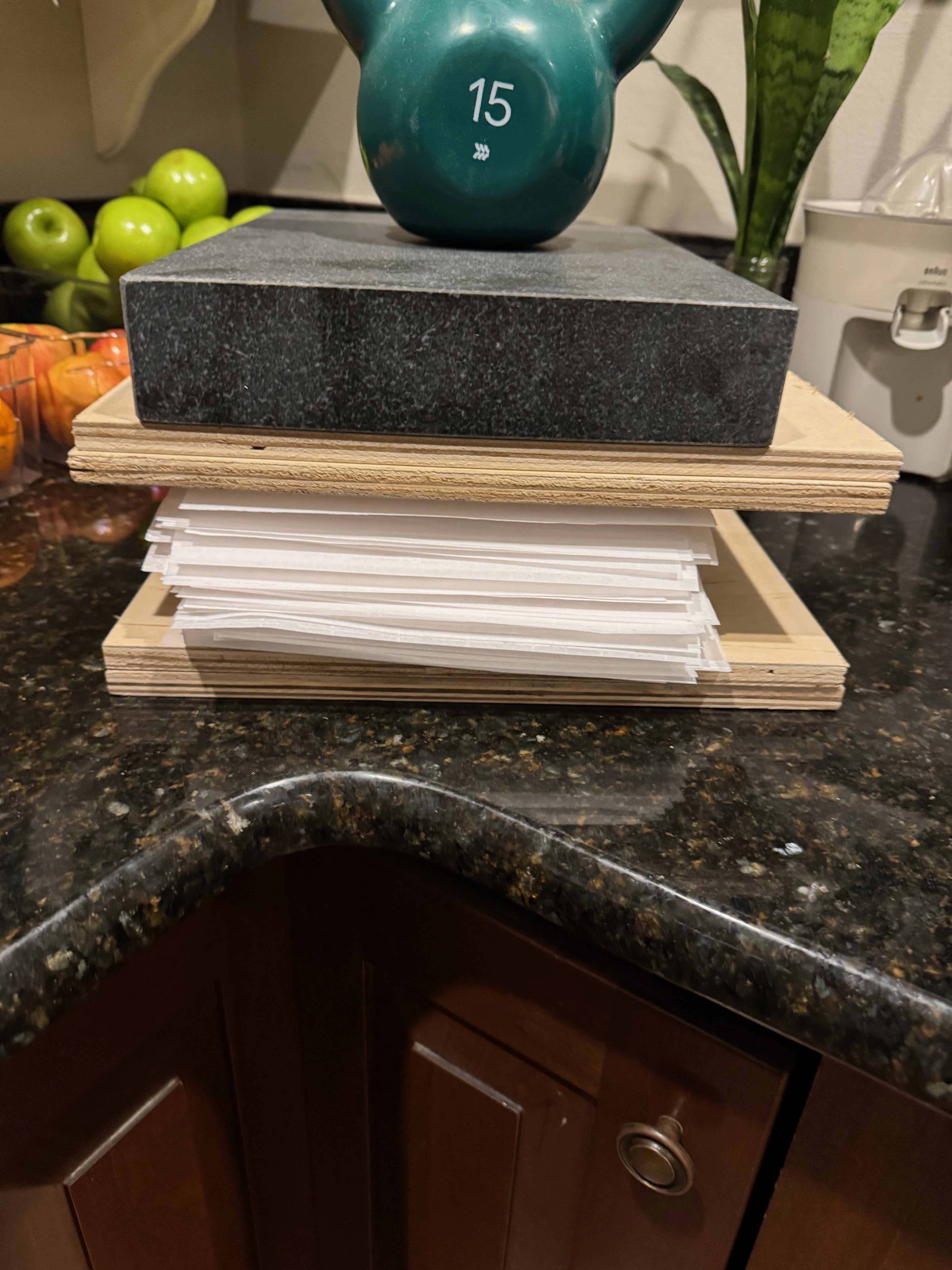 Layers of signatures and parchment paper under weight